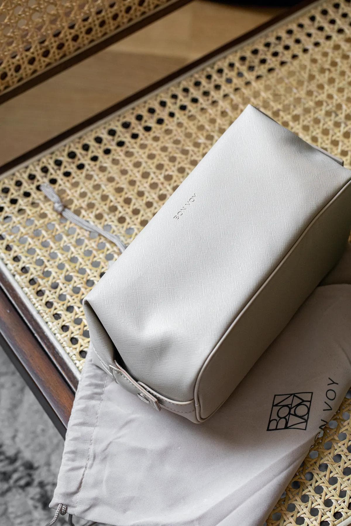 Bon Voy bag on woven chair with dustbag